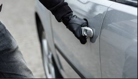 Suspect opening a car door (photo)